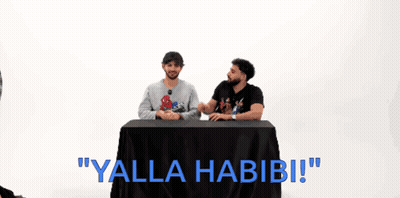 Two Men At Table Saying Yalla Habibi GIF