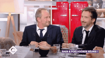 Two Men At Table With Baer & Poelvoorde Reunis GIF