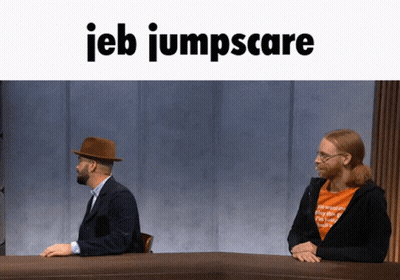 Two Men At Table With IEB Jumpscare GIF