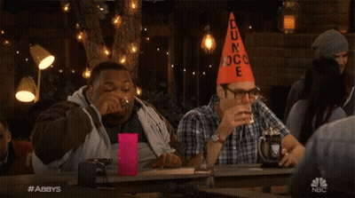 Two Men At Table With Orange Cone Saying Dun Rock GIF