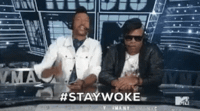 Two Men At Table With #Staywoke GIF