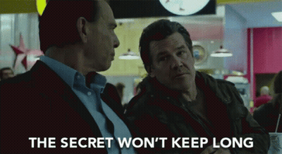 Two Men At Table With Text The Secret Won't Keep Long GIF