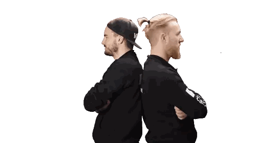 Two Men Back-To-Back Arms Crossed One In Carhartt Sticker