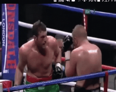 Two Men Boxing In A Ring With A Banner That Says ' Lonsdale ' On It GIF
