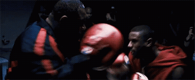 Two Men Boxing In Dark Room Red Gloves GIF