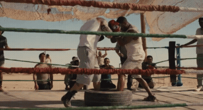 Two Men Boxing in Ring