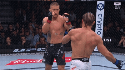 Two Men Boxing In Ring With Crypto Sign GIF