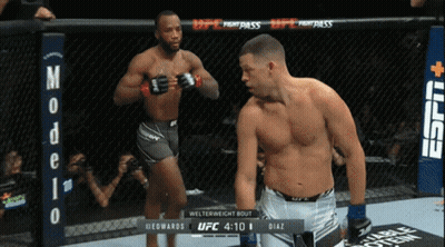 Two Men Boxing In Ring With Modelo Sign GIF