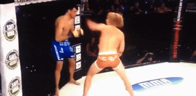 Two Men Boxing In Ring With UFC Banner GIF