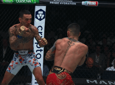 Two Men Boxing Sign Saying Drink Prime Prime Hydration GIF