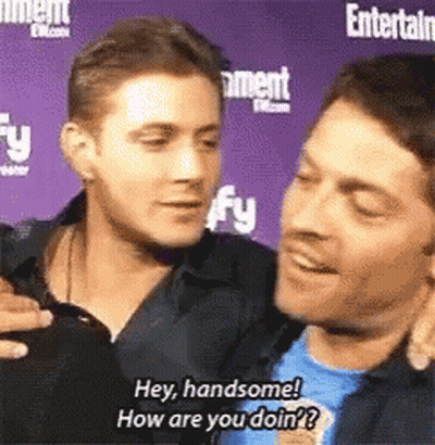 Two Men Chatting Hey Handsome How Are You GIF