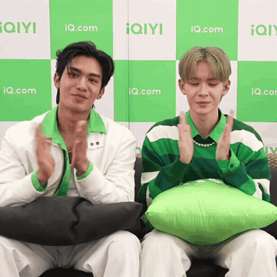 Two Men Clapping In Front Of IQ.com Wall GIF