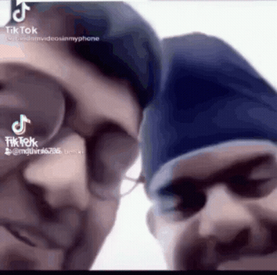 Two Men Close Up With TikTok Written Below GIF