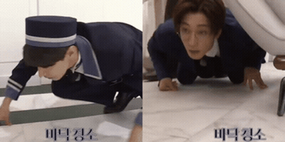 Two Men Crawling On Floor One Wearing Hat GIF