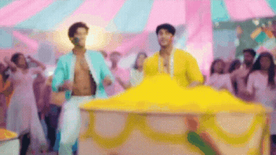 Two Men Dancing At Carnival GIF