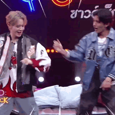 Two Men Dancing Before Neon CK Sign GIF