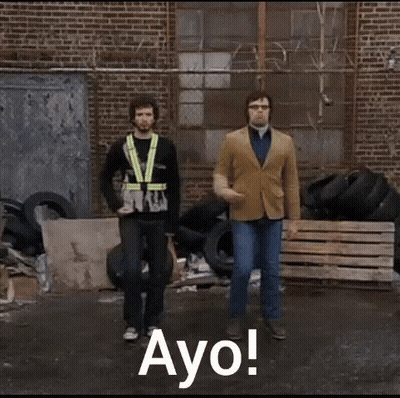 Two Men Dancing By Tire Pile Saying Ayo GIF