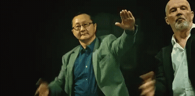 Two Men Dancing In Dark Room GIF