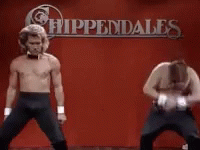 Two Men Dancing In Front Of Appendales Sign GIF
