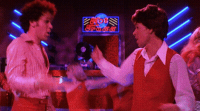 Two Men Dancing In Front Of Bob's Place Neon Sign GIF