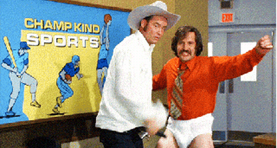 Two Men Dancing In Front Of Champ Kind Sports Mural GIF