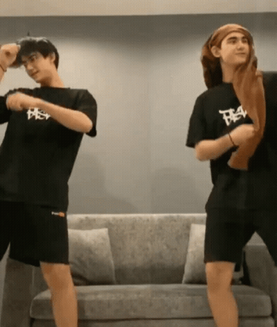 Two Men Dancing In Front Of Couch GIF