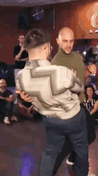 Two Men Dancing In Front Of Crowd GIF
