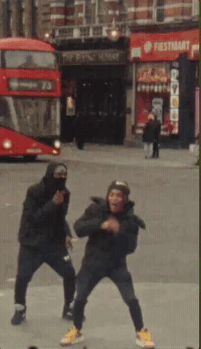 Two Men Dancing In Front Of Fiesta Mart Store GIF