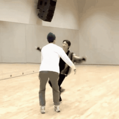 Two Men Dancing In Front Of Mirror GIF