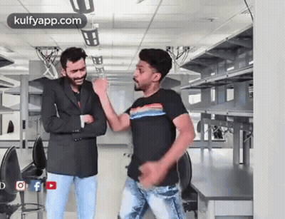 Two Men Dancing Next To Each Other GIF