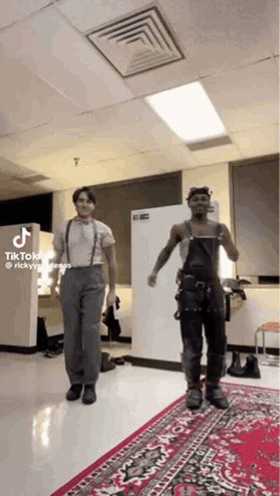 Two Men Dancing On Red Rug GIF