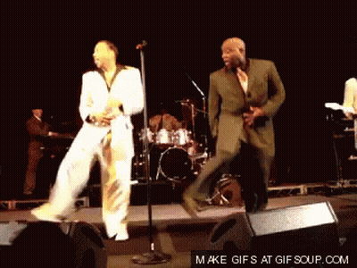 Two Men Dancing On Stage GIF