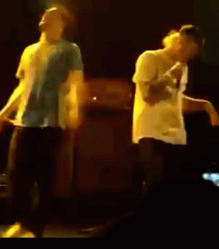 Two Men Dancing On Stage GIF