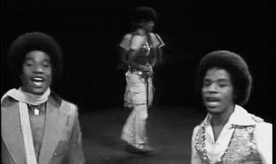 Two Men Dancing On Stage GIF