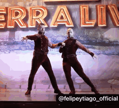 Two Men Dancing On Stage Erra Liv GIF