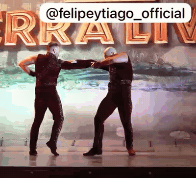 Two Men Dancing On Stage Ferra Live GIF