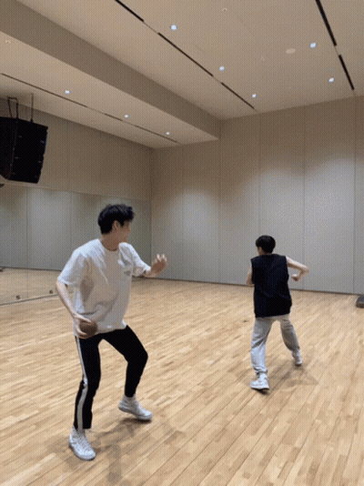 Two Men Dancing On Wood Floor GIF