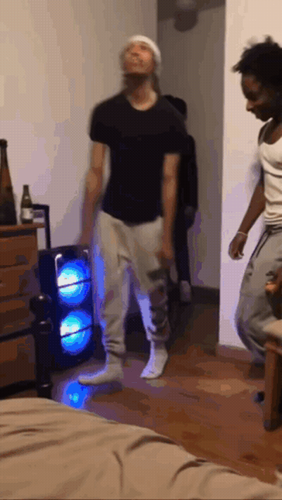 Two Men Dancing With Speaker GIF