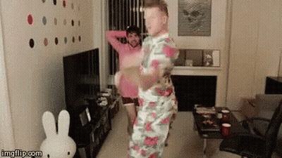 Two Men Dancing With Stuffed Bunny GIF