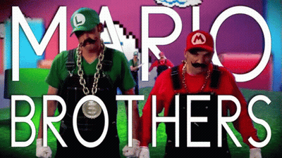 Two Men Dressed Up As Mario And Luigi Are Dancing GIF