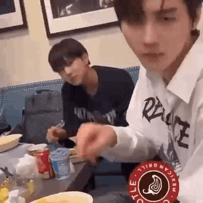 Two Men Eating and Drinking