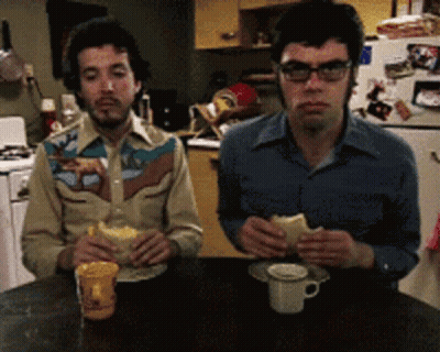 Two Men Eating One Wearing Cowboy Shirt GIF