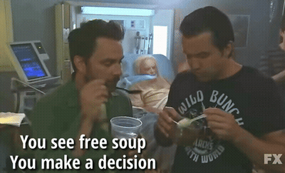 Two Men Eating Soup In Front Of Elderly Woman In Hospital Bed Saying You See Free Soup You Make A GIF