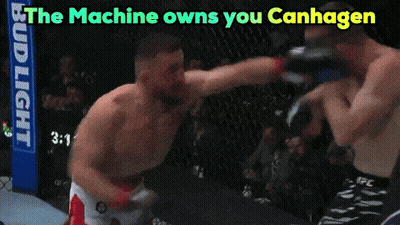 Two Men Fighting In A Ring Saying The Machine Owns You Canhagen GIF
