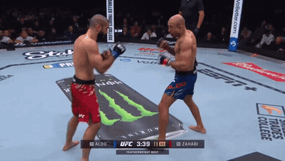 Two Men Fighting In Boxing Ring GIF