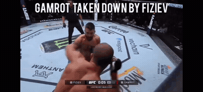 Two Men Fighting In Boxing Ring Gamrot Taken Down By Fiziev GIF