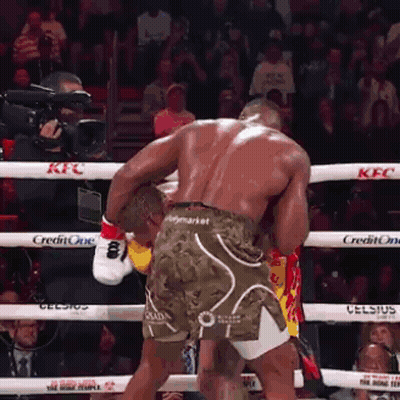 Two Men Fighting In Boxing Ring GIF