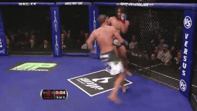 Two Men Fighting In Boxing Ring GIF