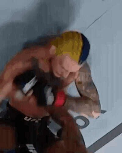 Two Men Fighting In Boxing Ring One Holding Sword GIF