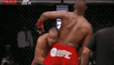 Two Men Fighting In Boxing Ring One In Red UFC Shorts GIF
